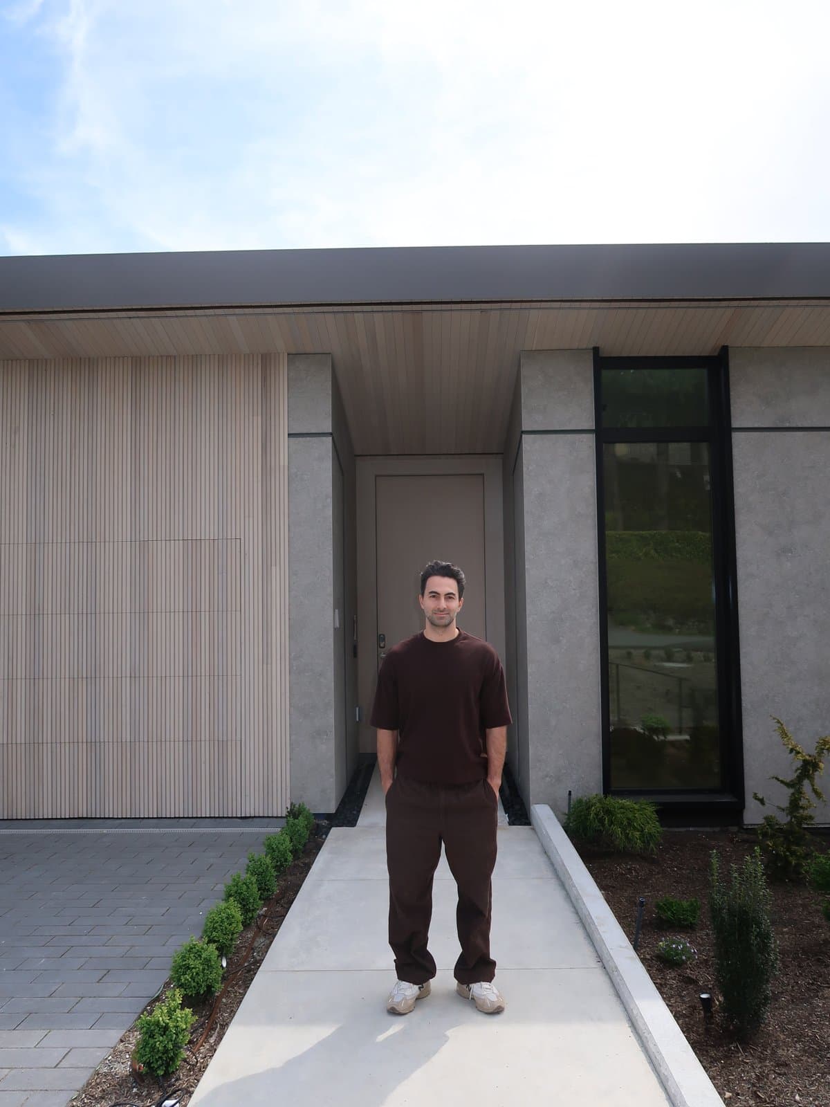 Primal Construction and Consulting, in front of a completed project