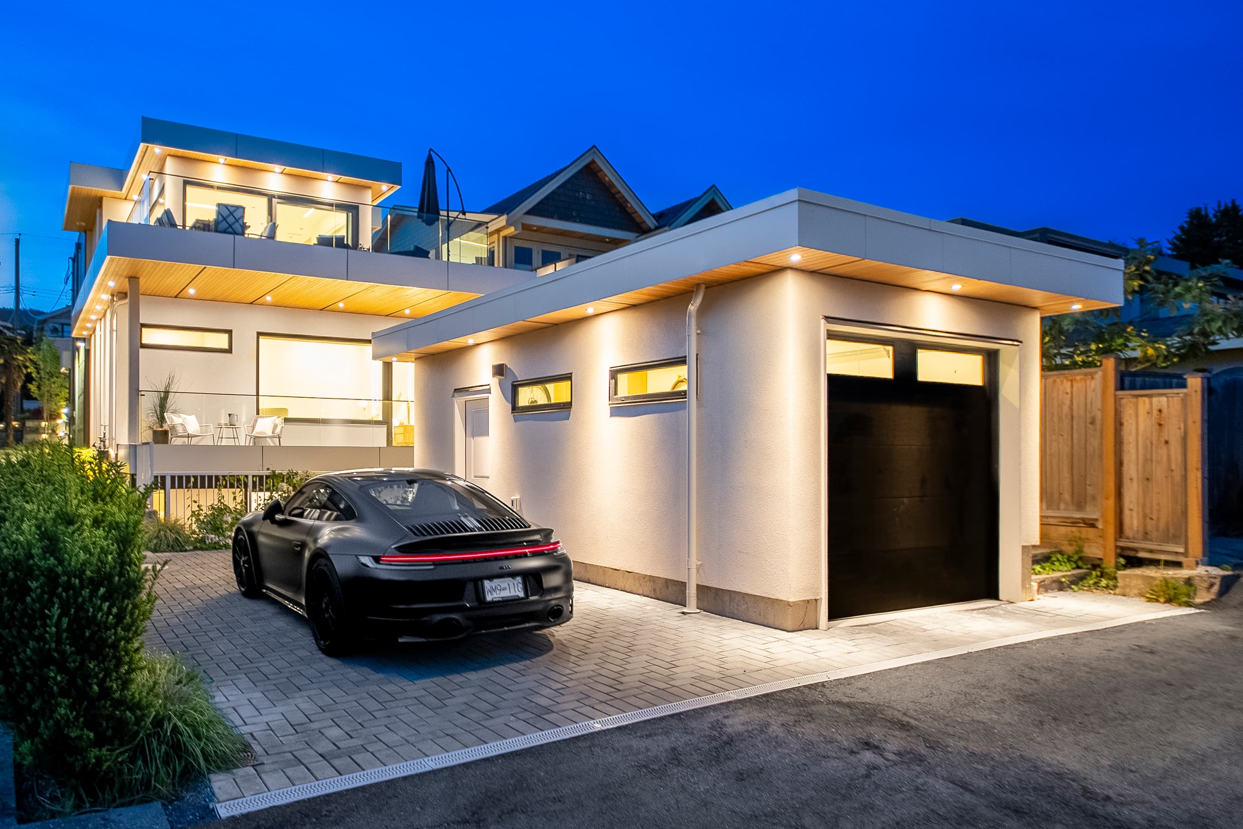 Duchess House — garage and driveway at dusk