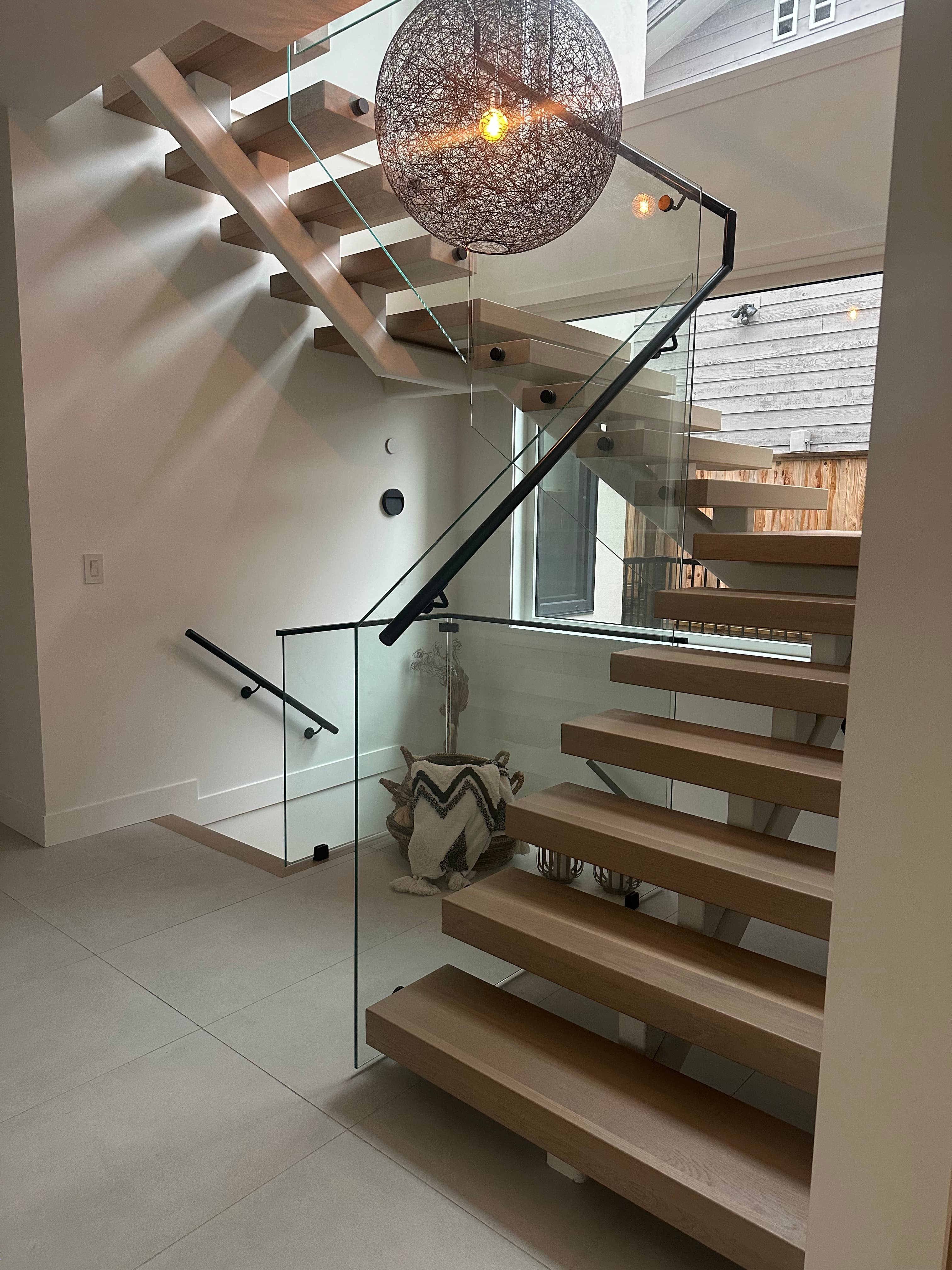 Jefferson House — floating staircase and double-height entry