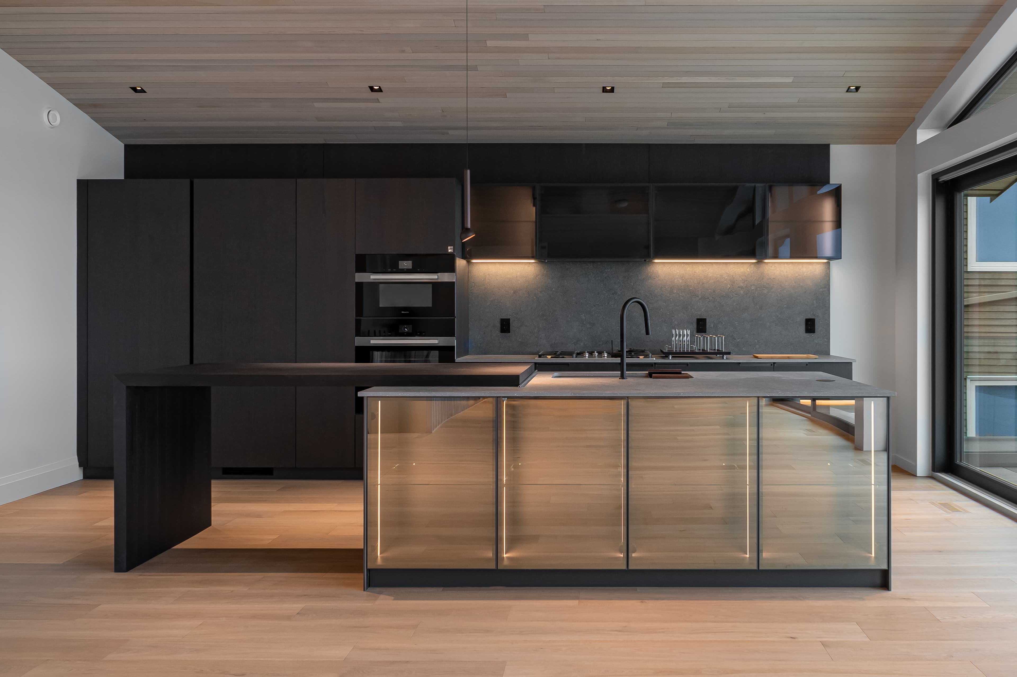 Nelson House 3 — kitchen island with illuminated glass storage